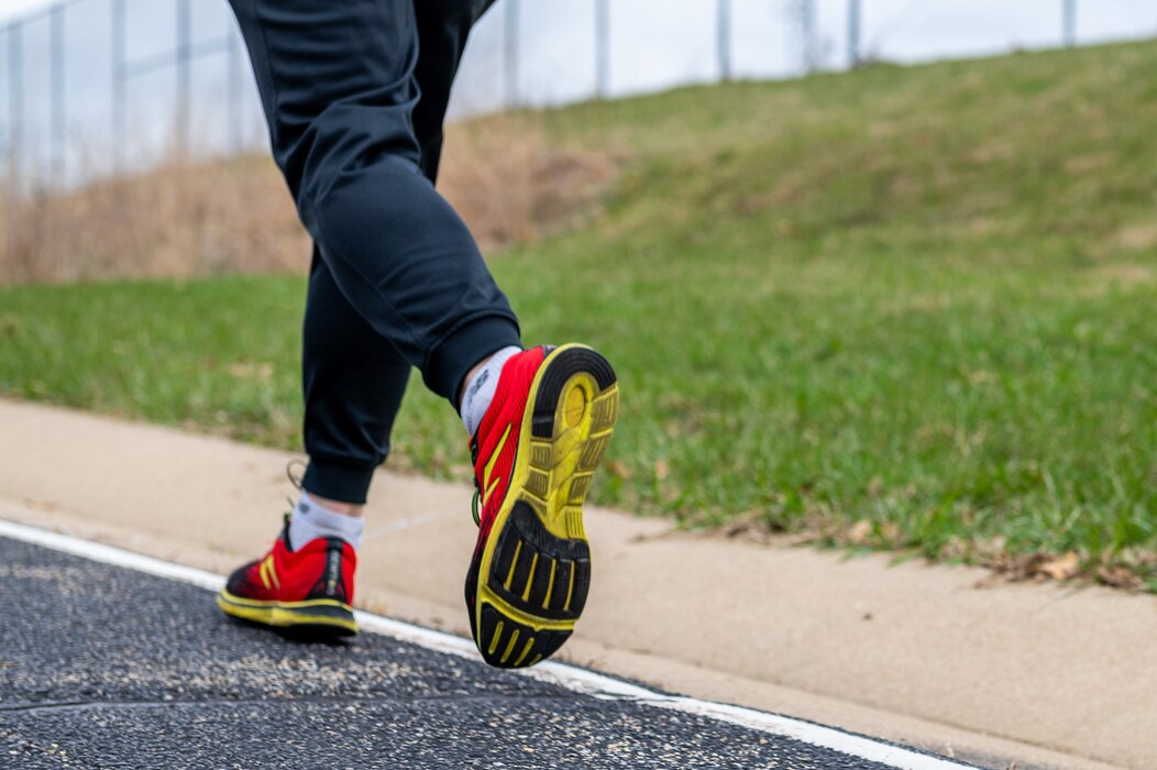 An Airman with the 182nd Airlift Wing, Illinois Air National Guard, runs in the annual Sexual Assault Response and Prevention run/walk at the 182nd Airlift Wing in Peoria, Illinois, April 1, 2023.