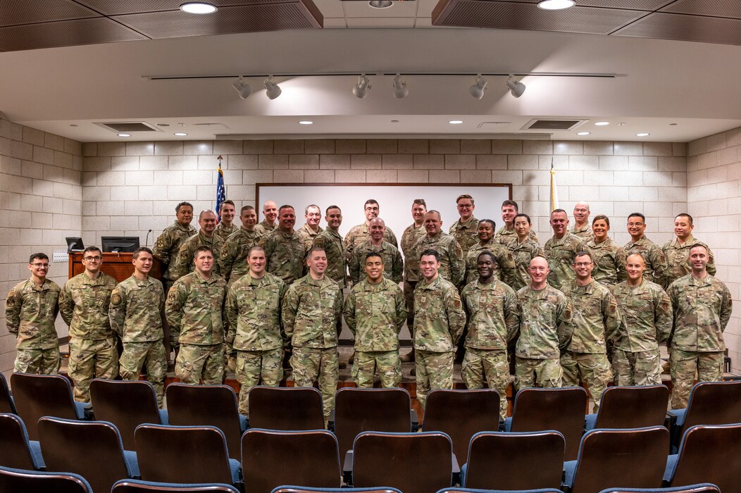 Airmen with the 182nd Communications Flight, Illinois Air National Guard, pose for group photo at the 182nd Airlift Wing, Peoria, Illinois, Jan. 7, 2023.