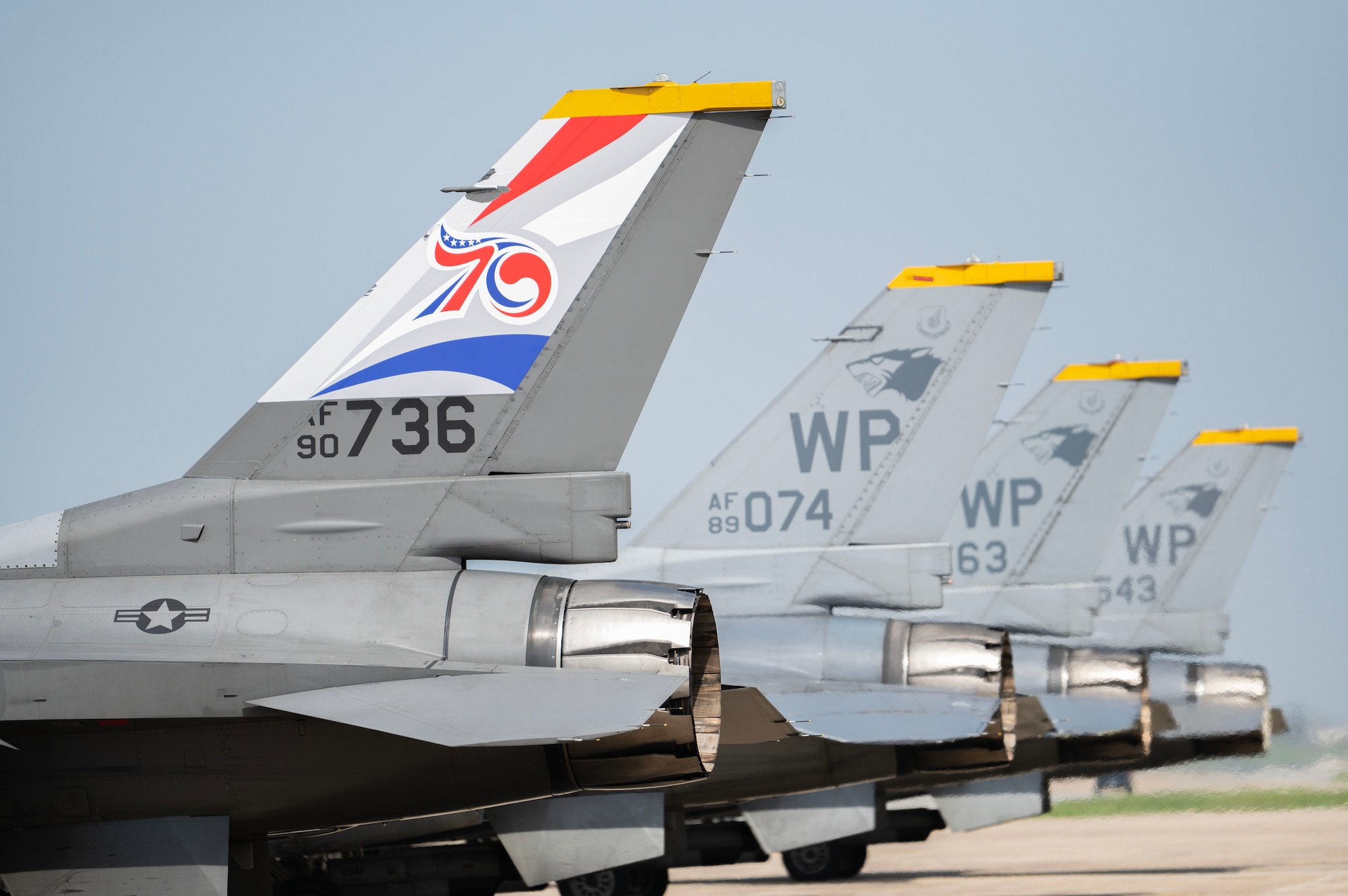 F-16 Fighting Falcons assigned to the 8th Fighter Wing, Kunsan Air Base, Republic of Korea, line up before taxiing to the runway, one with a U.S.-ROK Alliance 70th Anniversary tail flash, at Osan AB, ROK, May 7, 2023. The United States maintains U.S. forces on the Korean Peninsula in support of its commitment under the U.S.-ROK Mutual Defense Treaty to help defend against external threats. (U.S. Air Force photo by Senior Airman Karla Parra)