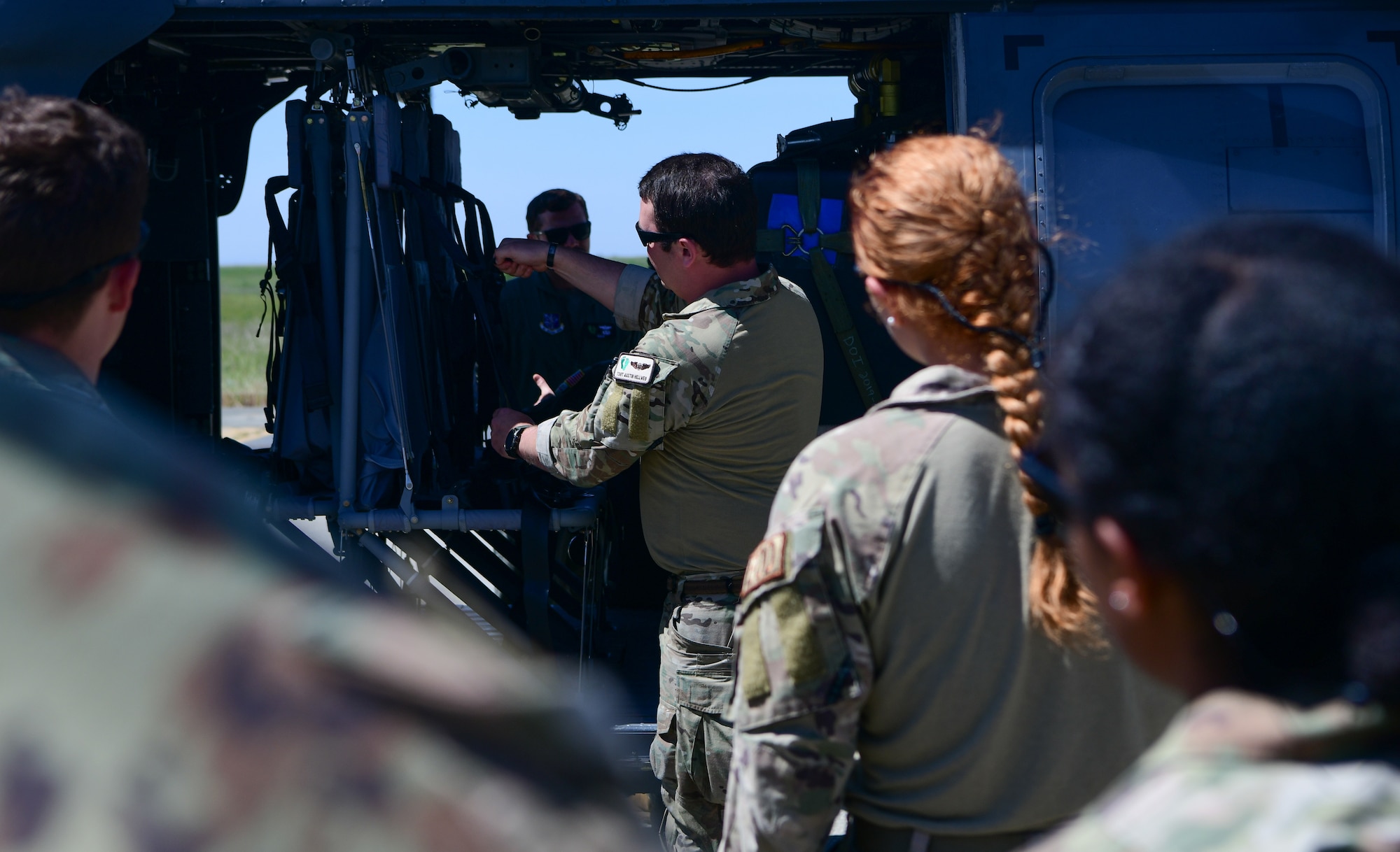 U.S. Air National Guard Tech. Sgt. Austin Hellweg, 129th Rescue Squadron pilot, gives a safety brief to Airmen from the 9th Civil Engineer Squadron on April 26, 2023, at Beale Air Force Base, California.