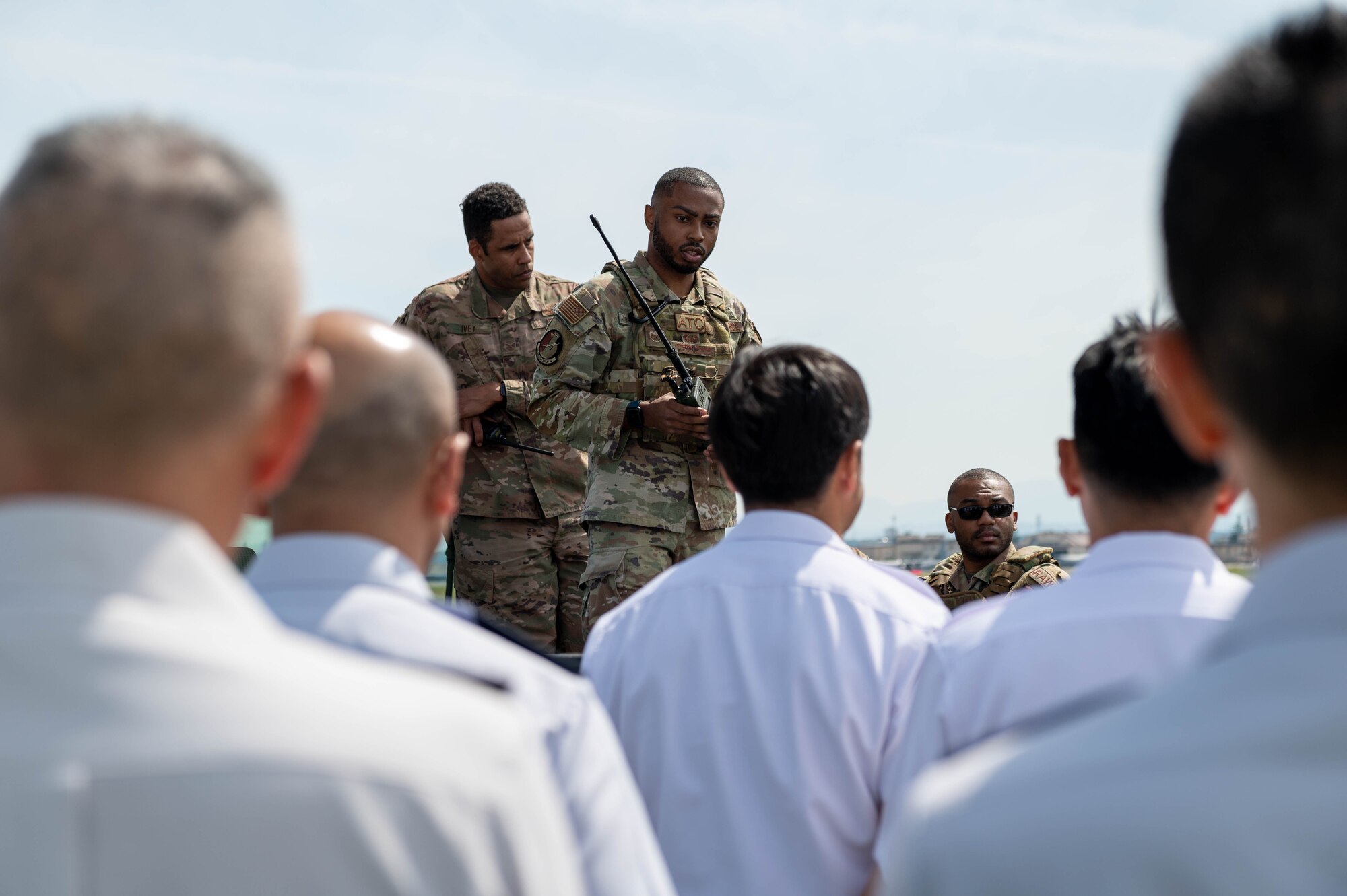 A service member speaks to attendees of the 2023 Senior Enlisted Leader Symposium at Yokota Air Base, Japan.