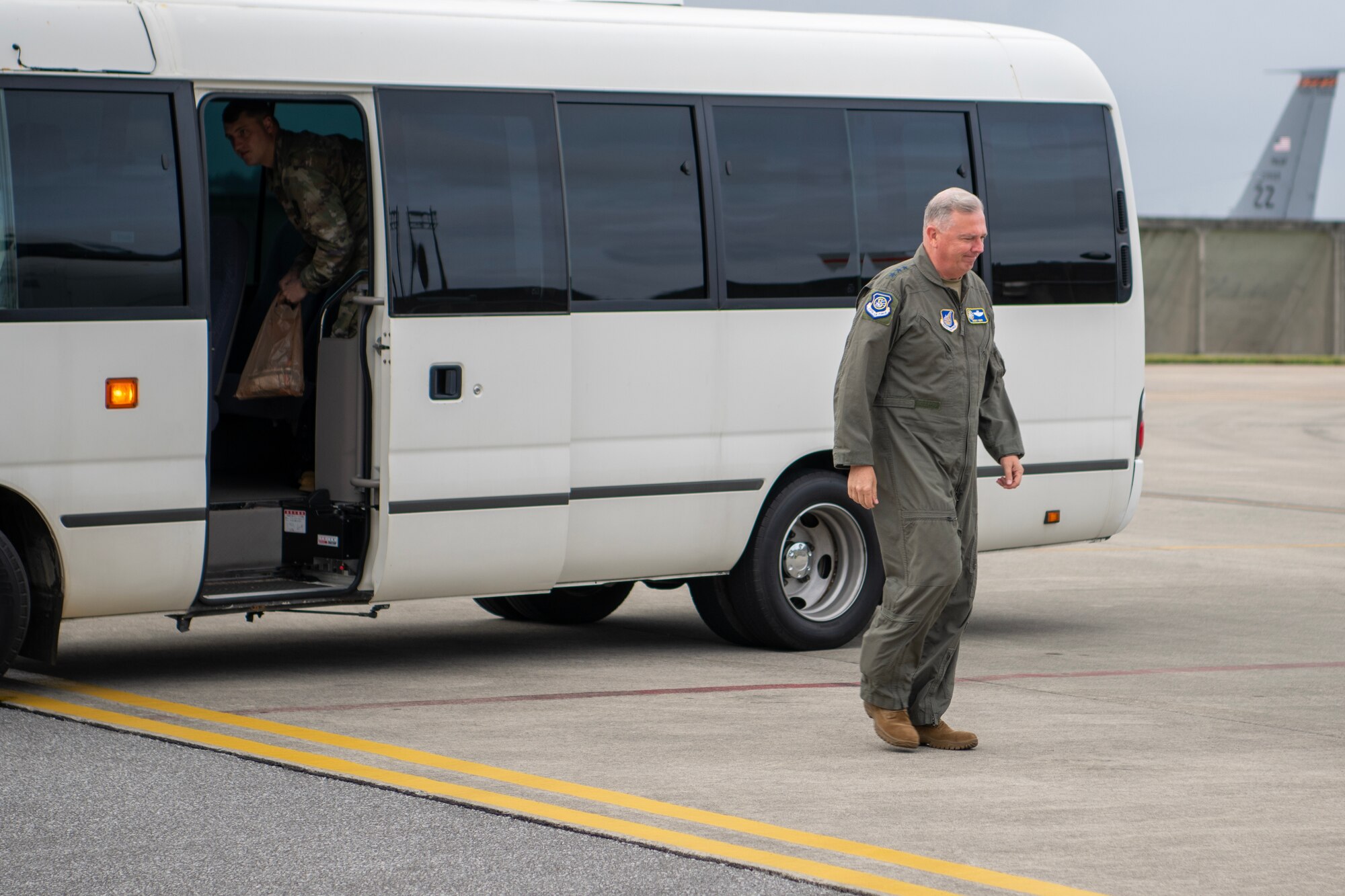 General Rupp walks towards an AWACS.