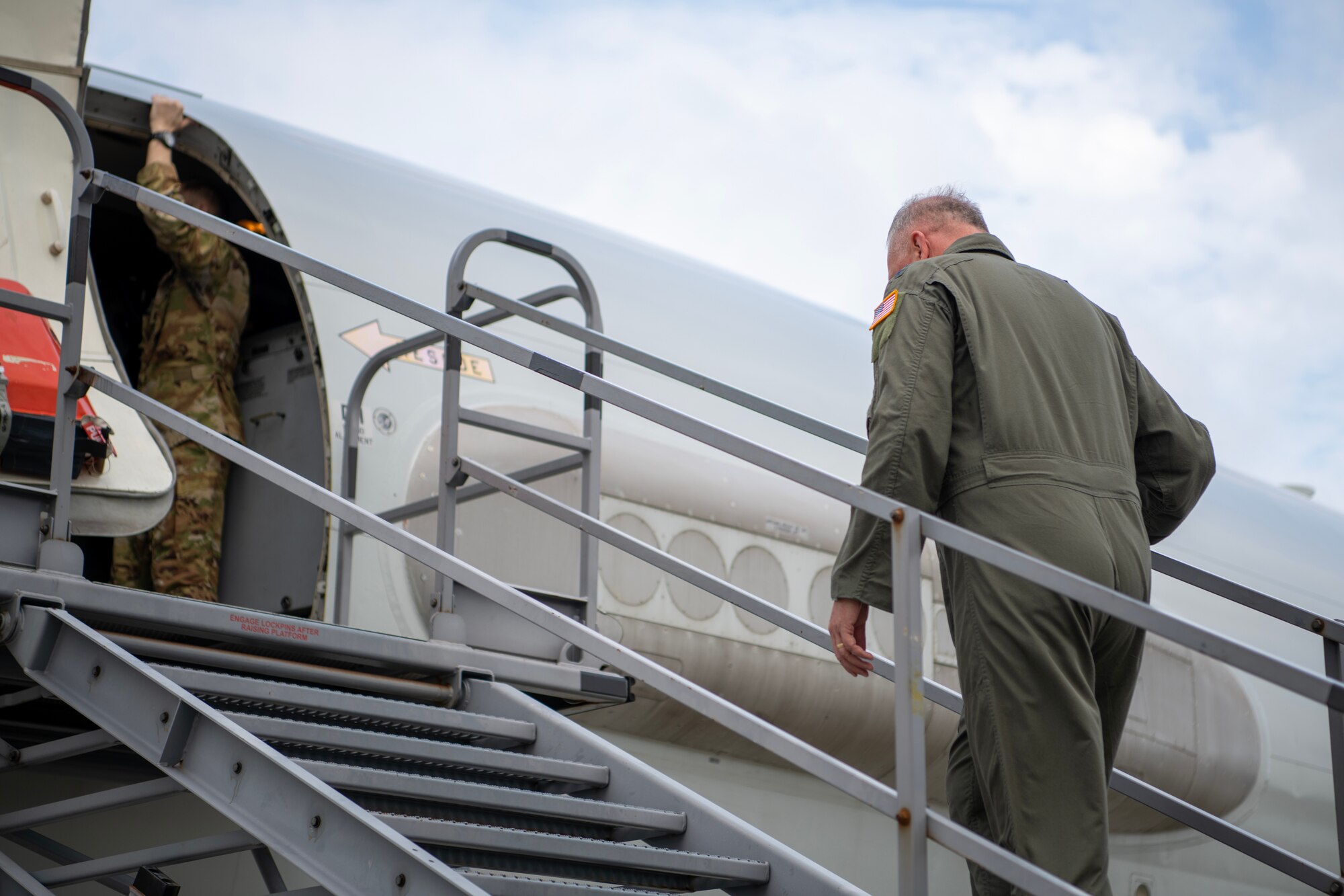 General Rupp boarding an aircraft.