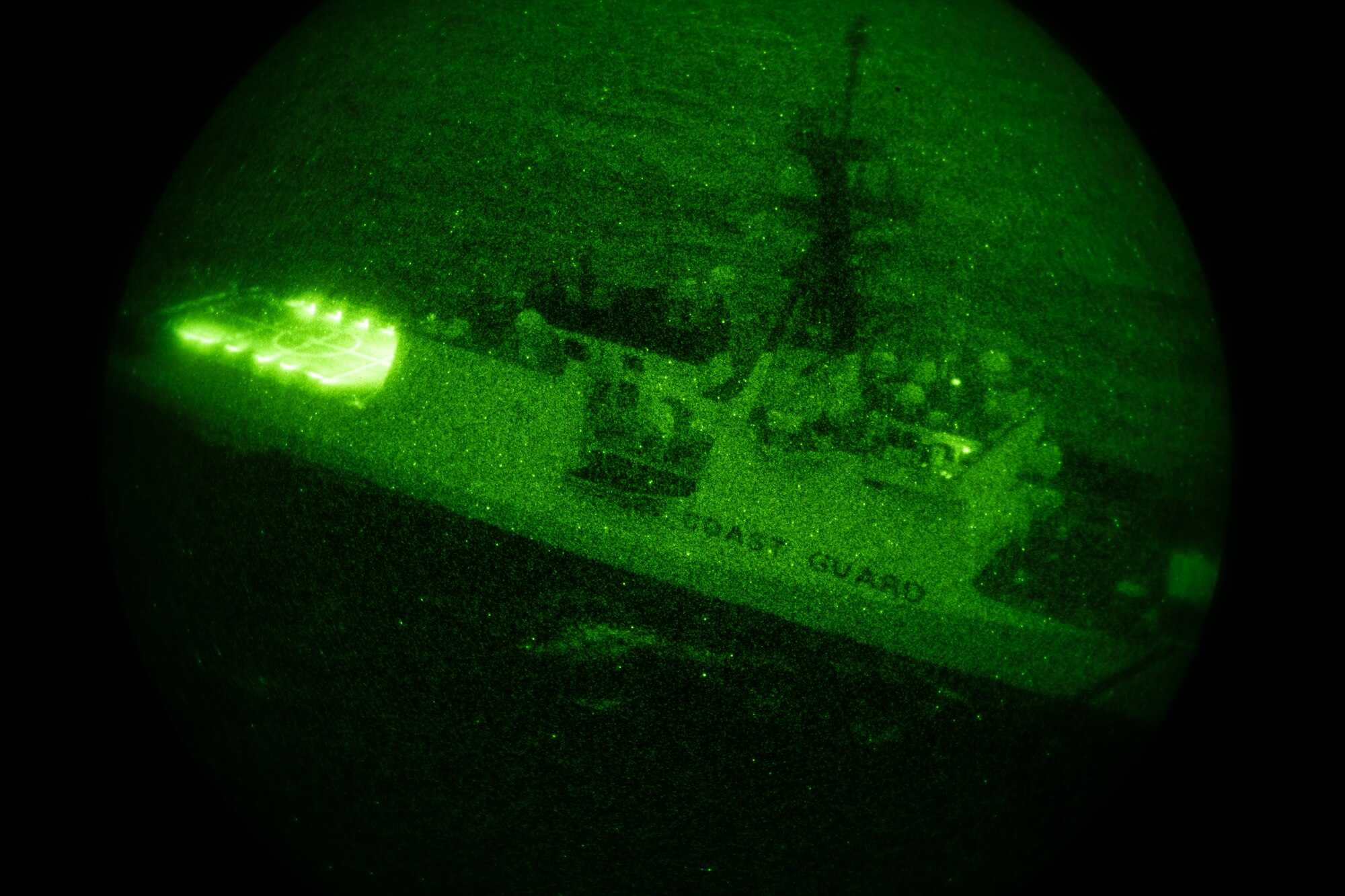 A U.S. Coast Guard ship sails off the coast of Okinawa for nighttime maritime vessel deck landing training with the 33rd Rescue Squadron May 5, 2023. The training allows rescue aircrew to maintain and improve their abilities to land on naval vessels to conduct successful rescue missions. (U.S. Air Force photo by Senior Airman Cedrique Oldaker)