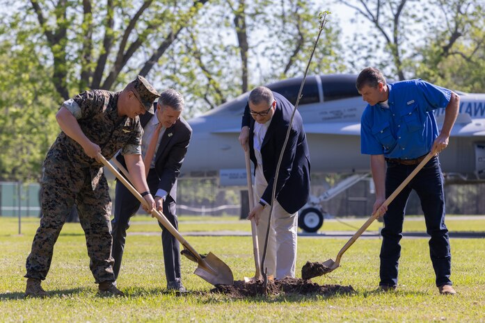 U.S. Marine Corps Col. Karl Arbogast, commanding officer, Marine Corps Air Station (MCAS) Beaufort, Jad Daley, president and chief executive officer, American Forests, Karnig Ohannessian, Deputy Assistant Secretary of the Navy of Environment and Mission Readiness, and Gary Herndon, natural and cultural resources manager, MCAS Beaufort, plant a tree during a commemorative tree planting ceremony in celebration of Earth Day at Marine Corps Air Station Beaufort, South Carolina, April 19, 2023. American Forests gifted an estimated 1,008,625 pine tree seedlings that will be planted at Townsend Bombing Range, Georgia. This reforestation effort will cover over 1600 acres. (U.S. Marine Corps photo by Lance Cpl. Kyle Baskin)