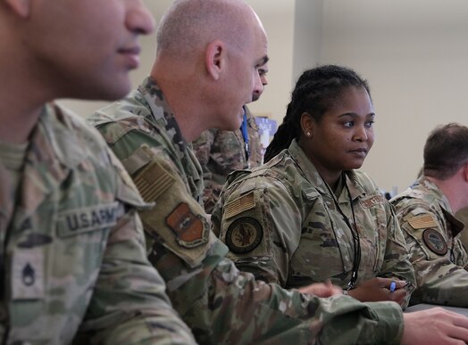  Uniformed US military personnel train at computers during the Air Operations Center Initial Qualification Training Course at Hurlburt Field, Florida.