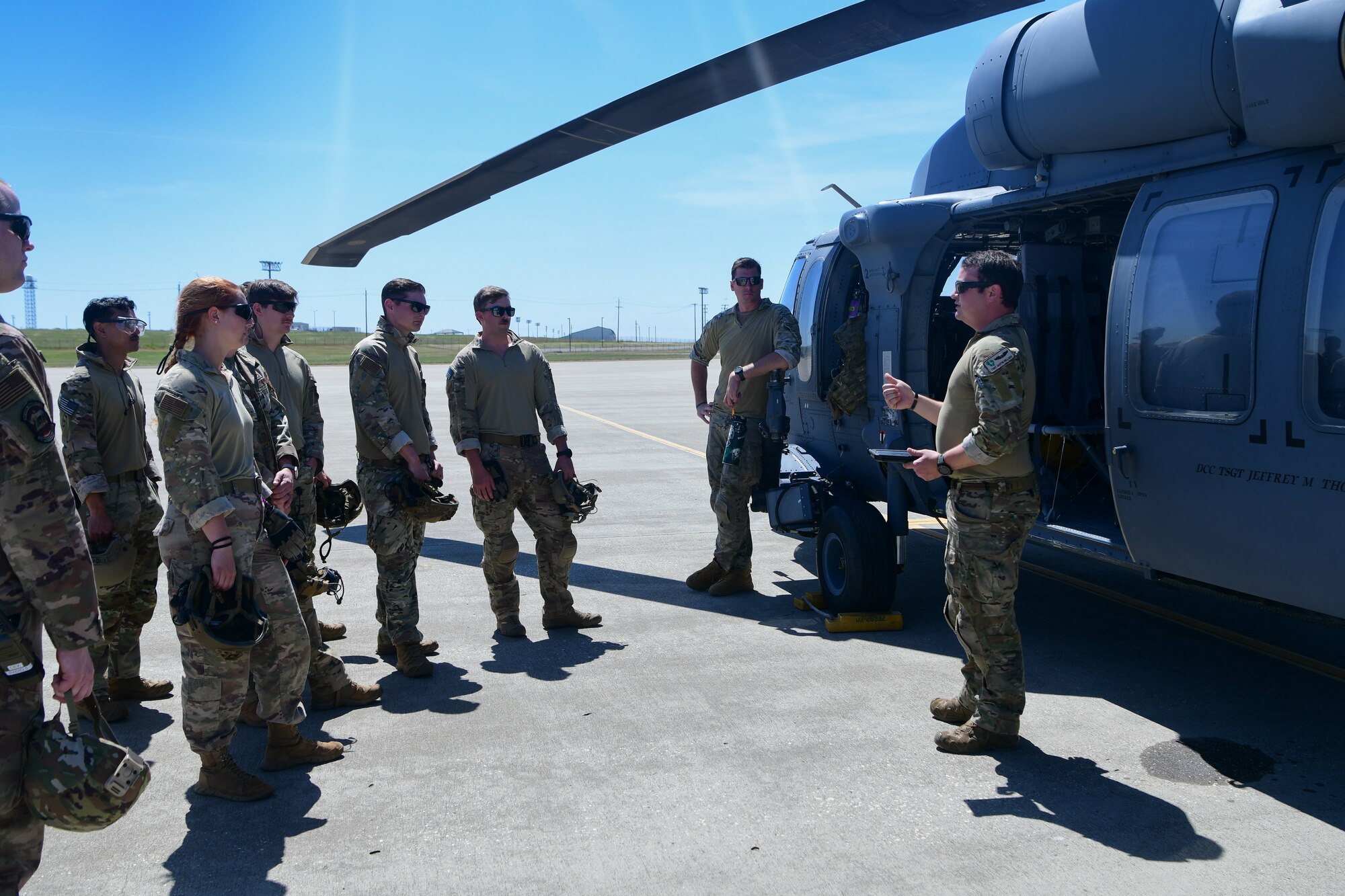 U.S. Air National Guard Tech. Sgt. Austin Hellweg, 129th Rescue Squadron pilot, briefs trainees from the 9th Civil Engineer Squadron for helicopter training April 26, 2023, at Beale Air Force Base, California.