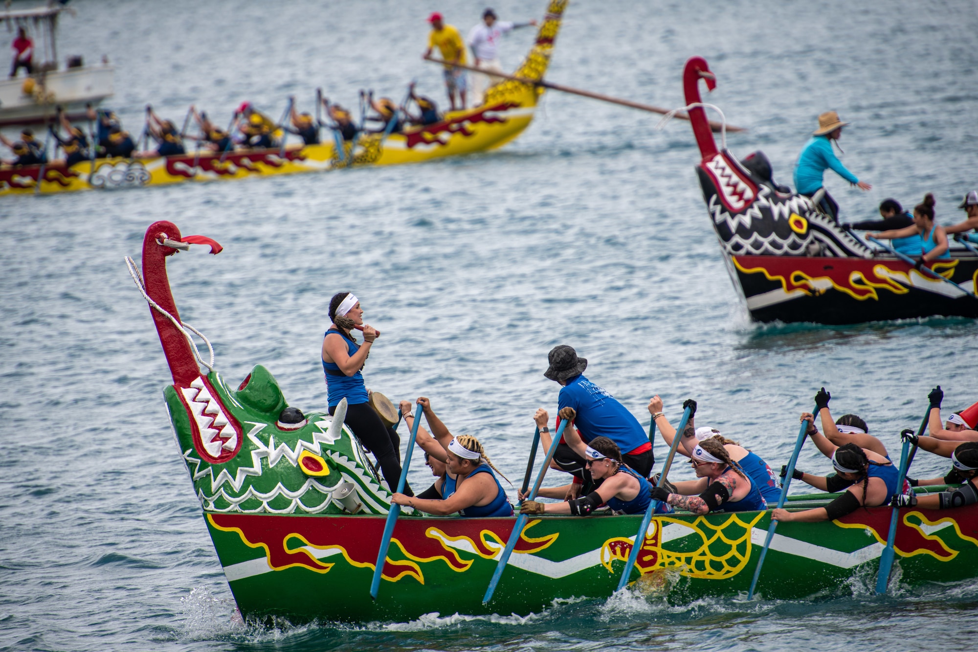 Kadena Air Base’s Shogun Women, the U.S. Navy’s Nirai Kanai Women and the Sabani Soul Sisters boat race teams compete in the 2023 Naha Hari Dragon Boat Races in Naha City, Japan, May 5, 2023. The races marked the culmination of months of training by U.S. and Japanese teams from across Okinawa. (U.S. Air Force photo by Lt. Col. Raymond Geoffroy)