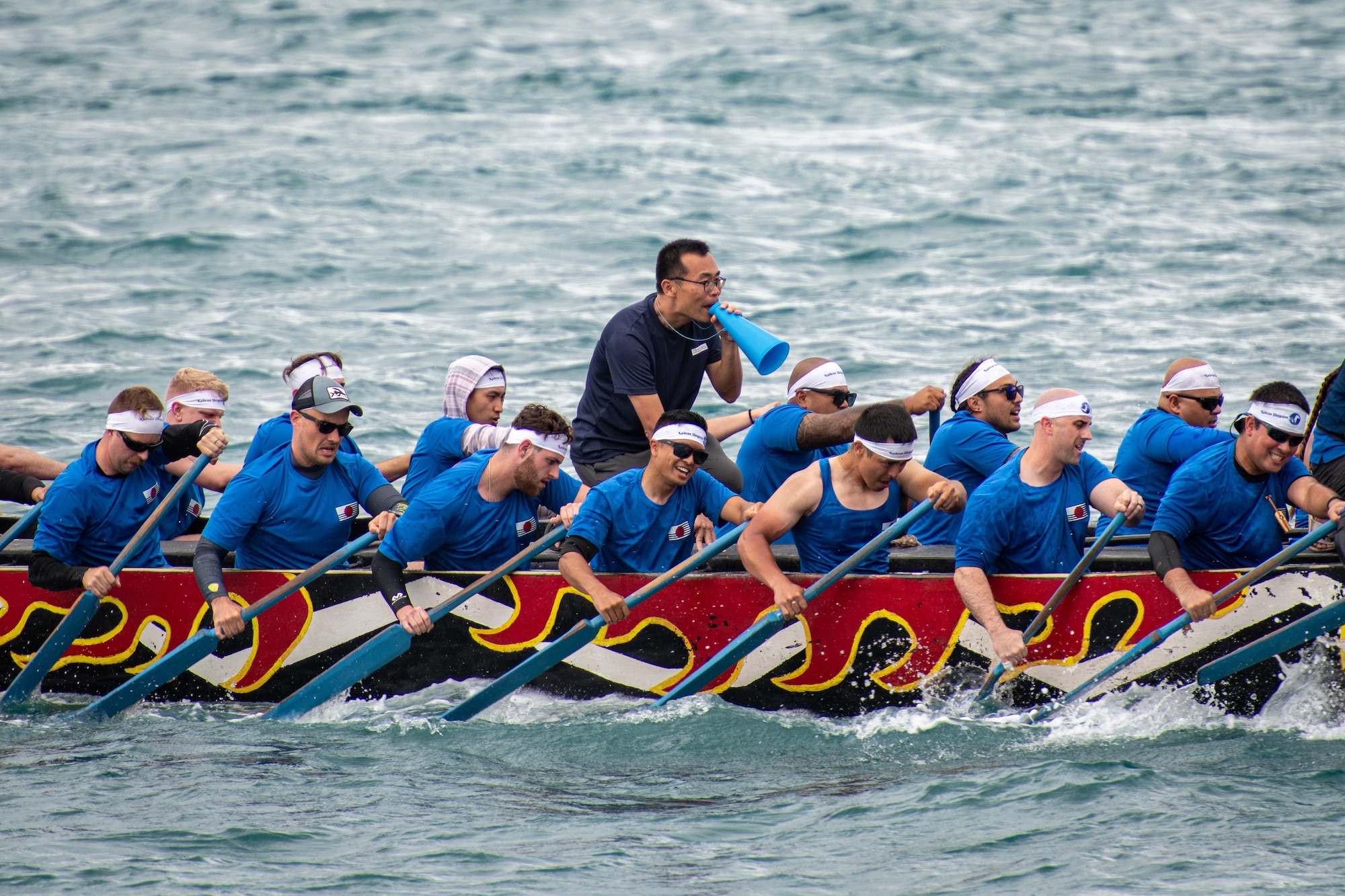 Kadena Air Base’s Shogun Men boat race team competes in the 2023 Naha Hari Dragon Boat Races in Naha City, Japan, May 5, 2023. Teams from Kadena Air Base joined other U.S. and Japanese boat teams in the first races held since the start of the COVID-19 pandemic. (U.S. Air Force photo by Lt. Col. Raymond Geoffroy)