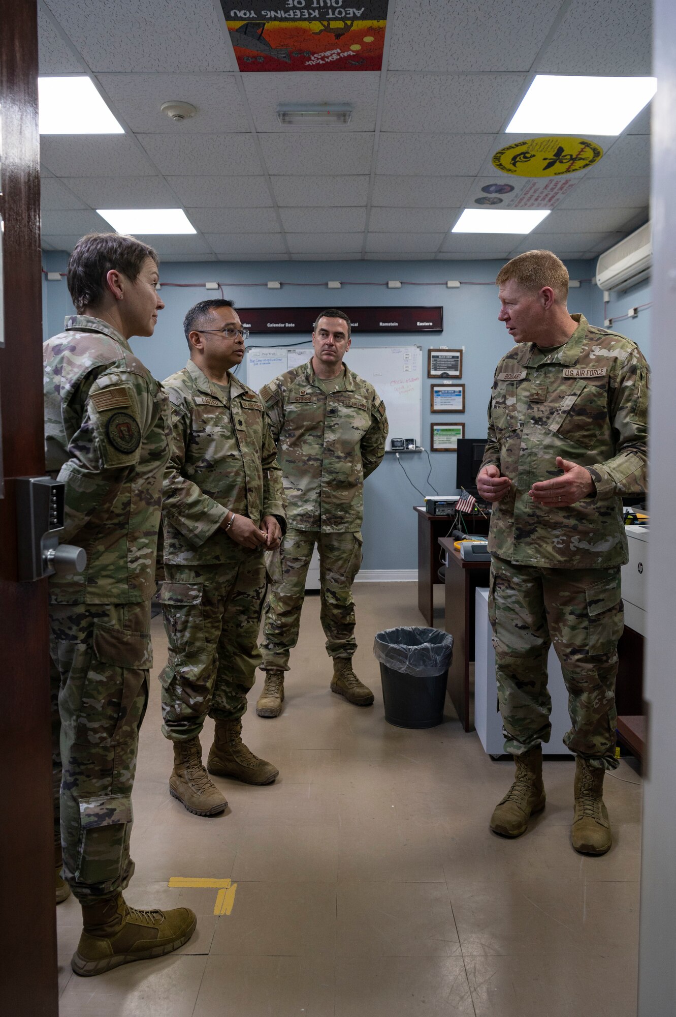 U.S. Air Force Brig. Gen. Robert Bogart, Headquarters Air Combat Command command surgeon, is briefed during a tour at Ali Al Salem Air Base, Kuwait, May 8, 2023.