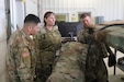 U.S. Army Reserve CW3 Wendy Hoven observes Soldiers as they run diagnostics on a trailer at Fort McCoy, Wis. On May 3, 2023.