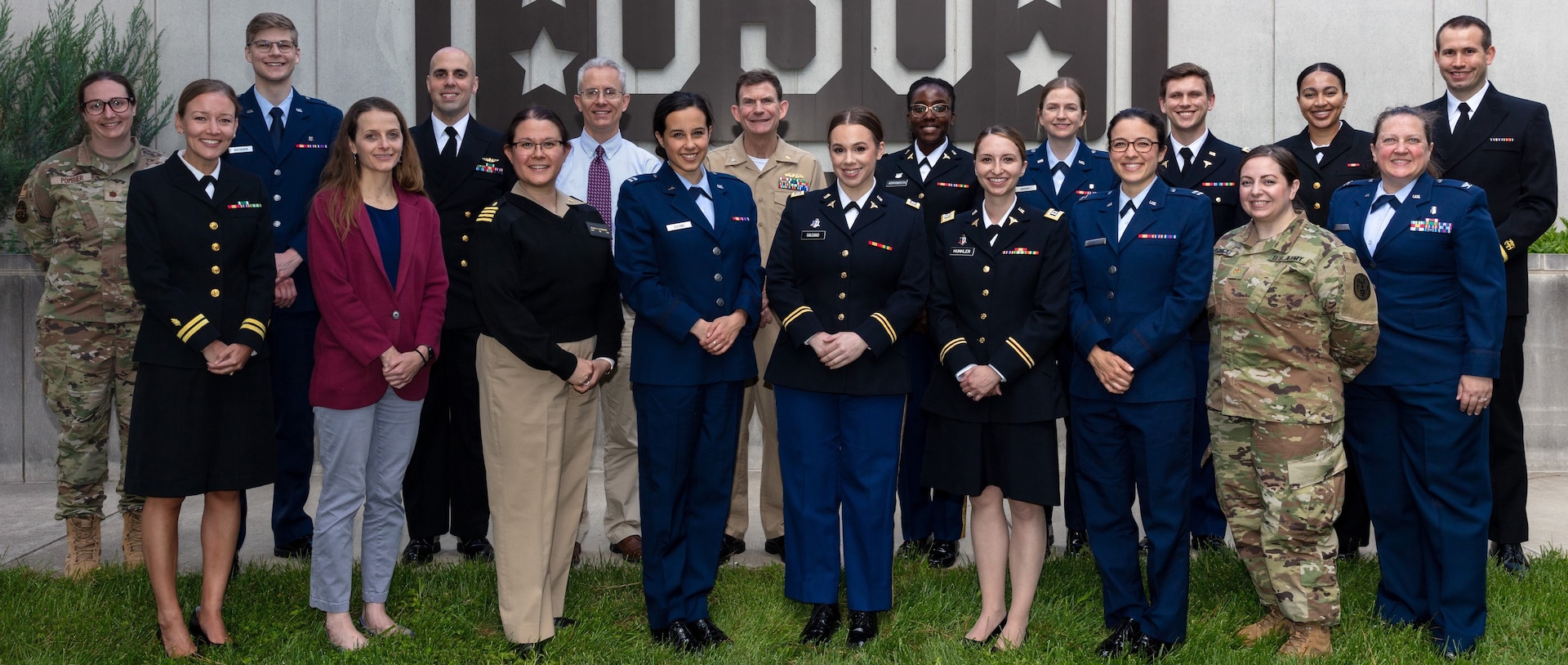 Staff and residents of the National Capital Consortium Uniformed Services Residency in Gynecologic Surgery and Obstetrics program, along with Dr. Christopher Ennen (back row, third from left), fellowship program director for Maternal Fetal Medicine Fellowship at the University of Virginia pause for a picture during the 28th Annual Robert C. Park Resident Research Day in Obstetrics and Gynecology, held on May 5 at Walter Reed.