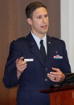 During the presentations for the Department of Research Programs' poster competition on May 3 at Walter Reed, Air Force Capt. (Dr.) Sidney Zven explains his research investigating food insecurity and the impact of WIC enrollment in military families.