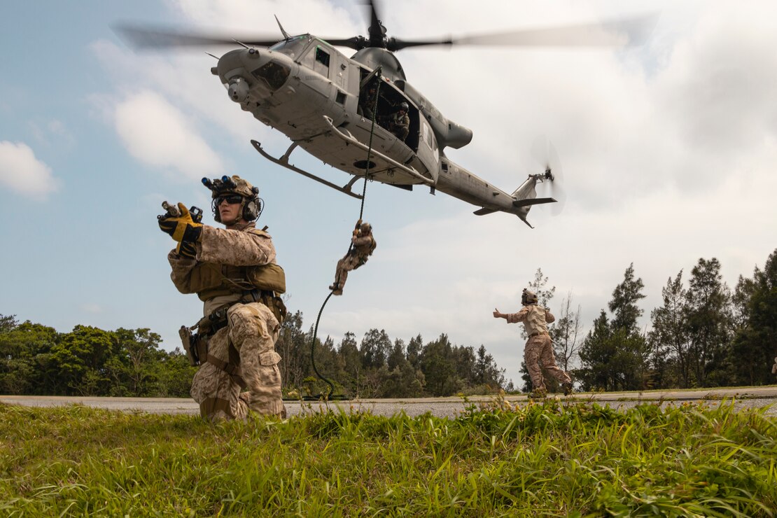 U.S. Marines with the maritime raid force, 31st Marine Expeditionary Unit, fast rope off a UH-1Y Venom helicopter and set up security during visit, board, search, and seizure tactics training at Camp Hansen, Okinawa, Japan, May 3, 2023. The VBSS training was conducted to teach BLT 2/1 Marines insertion methods and close quarter tactics for boarding and securing maritime vessels. The 31st MEU, the Marine Corps’ only continuously forward-deployed MEU, provides a flexible and lethal force ready to perform a wide range of military operations as the premier crisis response force in the Indo-Pacific region.