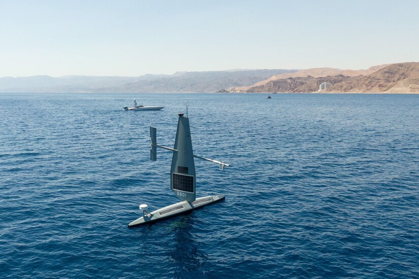 Two unmanned vessels float in the water.