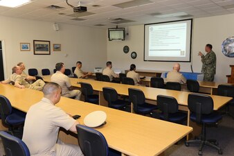 230510-N-YR423-6258 PENSACOLA, Fla. – Naval Education and Training Professional Development Center (NETPDC) Command Master Chief Andrew Rockman gives a presentation to the Naval Education and Training Command (NETC) domain fiscal year 2022 Sailor of the Year (SOY) candidates and their command master chiefs during a tour of NETPDC headquarters onboard Saufley Field in Pensacola, Florida, May 10, 2023. The brief discussed NETPDC’s mission of administering voluntary education programs, administering the Navy’s enlisted advancement program, and providing resources management services to assigned activities.  (U.S. Navy photo by Cheryl Dengler)