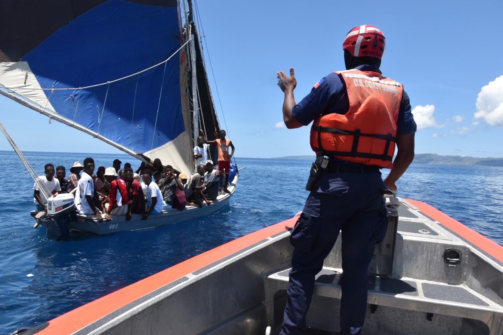 Haitian Coast Guard Officer Josue Philogene works alongside the USCGC Campbell (WMEC 909) crew to deter migrant vessel ventures at sea, April 18, 2023. While underway in the Seventh Coast Guard District’s area of responsibility, Campbell’s crew conducted maritime safety and security missions while working to detect, deter and intercept unsafe and illegal maritime migration ventures bound for the United States. (U.S. Coast Guard photo by Petty Officer 2nd Class Stephen Touchton)