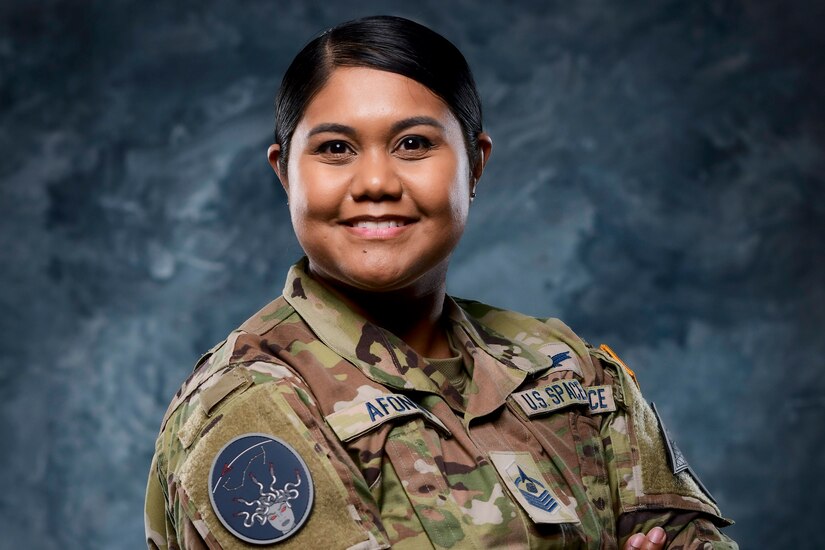 A guardian poses for a photo.