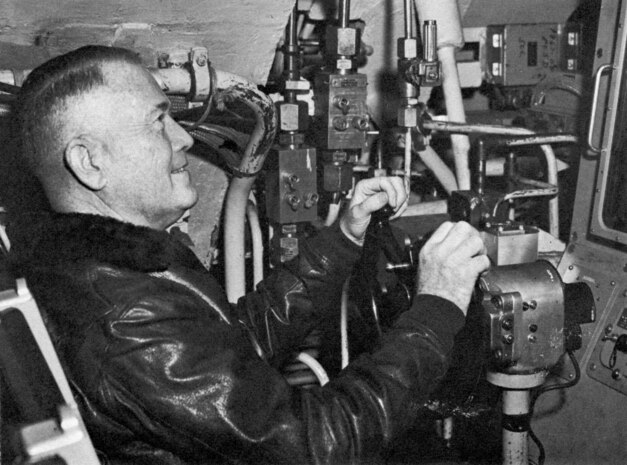 Rear Adm. William F. Raborn, appointed the first director of the U.S. Navy’s Special Projects Office (SPO) in Dec. 1955, sits at a submarine’s helm. Raborn made significant contributions to SPO’s mission by spearheading the development and testing of world's first submarine-launched ballistic missile (SLBM) and its related systems in conjunction with industry partners. To this day, the SLBM along with the Intercontinental ballistic missile and nuclear capable bombers create the nation’s strategic nuclear deterrence capability. Today, the Sea-Based Strategic Deterrence mission continues, although the SPO is now under a different moniker, U.S. Navy Strategic Systems Programs (SSP). SSP’s mission remains ever vital for the safety and security of the U.S. and her citizens at home and abroad. The triad of capabilities – SLBMs, ICBMs and nuclear capable bombers – are each undergoing modernization to ensure our nation’s ability to serve as the backbone of our nation’s security. (U.S. Navy Photo/Released)