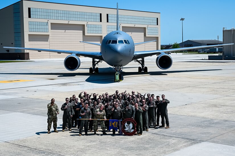 U.S. Air Force Airmen assigned to the 305th Air Mobility Wing pose for a flight line photo on 10 May, 2023 at Joint Base McGuire-Dix-Lakehurst, N.J. The 305th AMW extends America's global reach by generating, mobilizing and deploying KC-10 Extenders and C-17 Globemaster III’s to conduct strategic airlift and air refueling missions worldwide. In November 2021, the wing began transitioning to the new KC-46A Pegasus air refueling aircraft. Additionally, the Wing operates two of America's largest strategic aerial ports supporting the delivery of cargo and personnel to combatant commanders abroad.