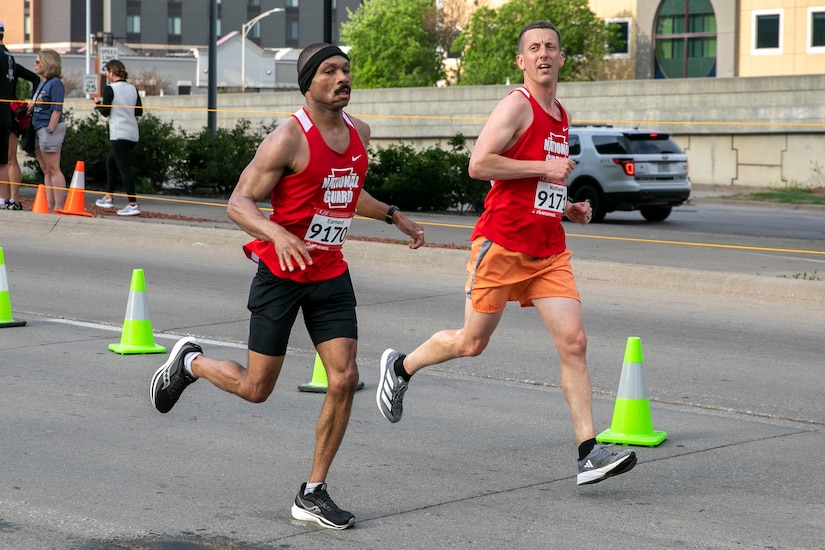 Sgt. 1st Class Earnest Fullwood, left, of the 876th Brigade Engineer Battalion, and Capt. Matthew Stern, right, of the 28th Expeditionary Combat Aviation Brigade, compete in the Lincoln Marathon May 7 in Lincoln, Nebraska. The race served as the tryout for the All-Guard Marathon Team. (U.S. Army National Guard photo by Sgt. Gauret Stearns)