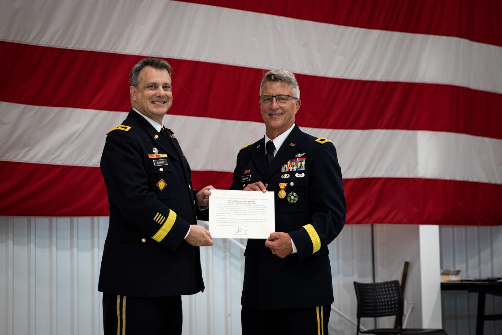 Maj. Gen. Thomas Mancino (left), adjutant general for Oklahoma, and Brig. Gen. Jon Harrison, former assistant adjutant general, pose at Harrison’s retirement ceremony at the Army Aviation Support Facility in Lexington, Oklahoma, May 6, 2023. Harrison built a distinguished career over the course of 39 years and earned many awards for his service, including the Legion of Merit and Bronze Star Medal. (Oklahoma National Guard photo by Spc. Danielle Rayon)