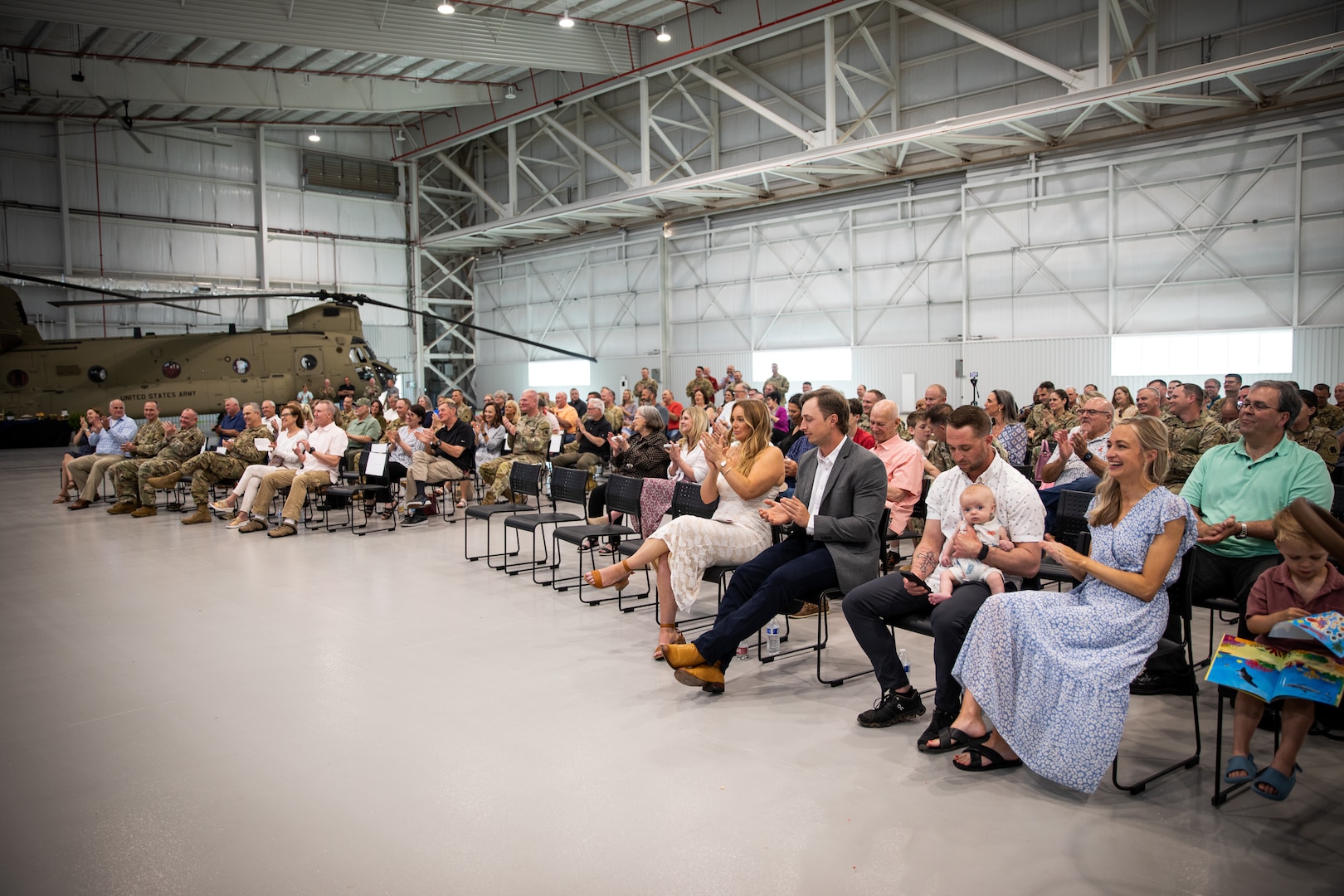 Audience members applaud during the retirement ceremony of Brig. Gen. Jon Harrison, former assistant adjutant general for Oklahoma, at the Army Aviation Support Facility in Lexington, Oklahoma, May 6, 2023. Harrison built a distinguished career over the course of 39 years and earned many awards for his service, including the Legion of Merit and Bronze Star Medal. (Oklahoma National Guard photo by Spc. Danielle Rayon)