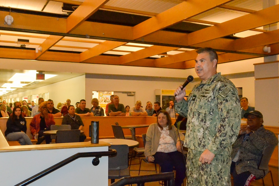 DLA Troop Support C&E Director U.S. Navy Capt. John Montinola talks with employees at a cultural improvement team event May 10. The CIT focuses on improving the climate and culture of the workforce by developing events and programs to enrich the workplace.