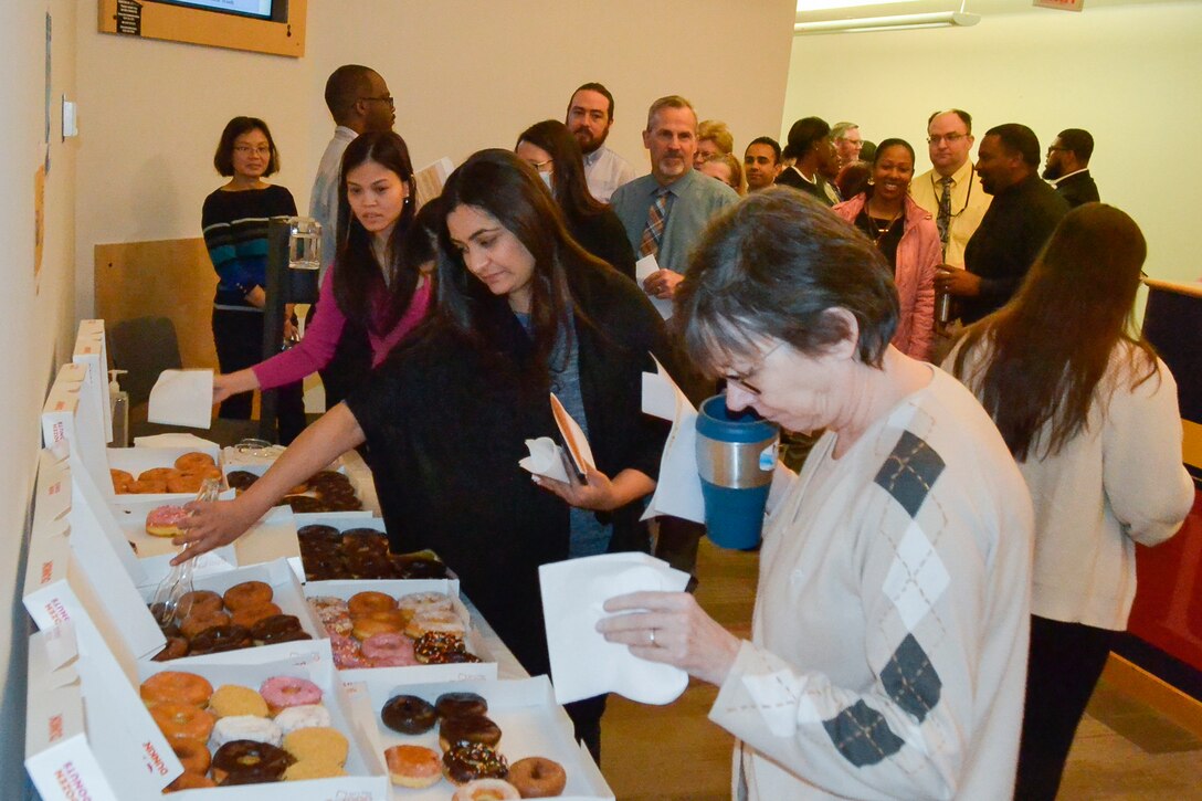 DLA Troop Support C&E employees share donuts and camaraderie during a cultural improvement team event May 10.
The CIT focuses on improving the climate and culture of the workforce by developing events and programs to enrich the workplace.