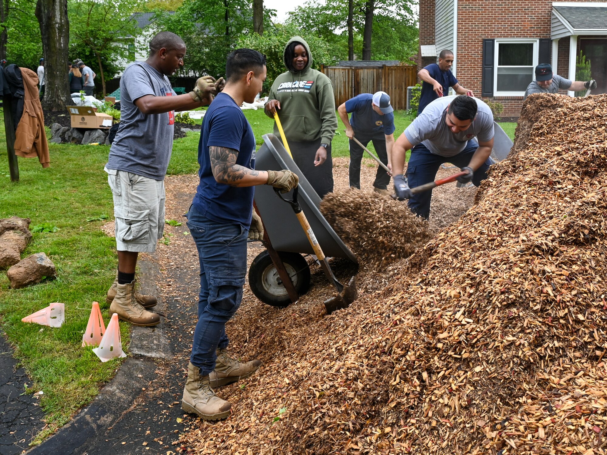 Members of the 113th Civil Engineer Squadron, District of Columbia Air National Guard, spread mulch and arrange segments of playground equipment as they participate in a volunteer project to complete the Master Sgt. Scott Walters Memorial Playground in Vienna, Virginia, April 29th, 2023. Walters, a well-loved member of the unit and community organizer, asked for the playground to be constructed as one of his final wishes. (U.S. Air Force photo by Tech. Sgt. Andrew Enriquez)