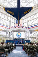 Force Master Chief Rick Mengel, center, Naval Education and Training Command’s (NETC) force master chief, delivers opening remarks during NETC’s fiscal year 2022 Sailor of the Year (SOY) announcement and award ceremony at the National Naval Aviation Museum in Pensacola, Florida, May 11, 2023. NETC's mission is to recruit, train and deliver those who serve our nation, taking them from street-to-fleet by forging civilians into highly skilled, operational and combat ready warfighters. (United States Navy photo by Mass Communication Specialist 2nd Class Zachary Melvin)
