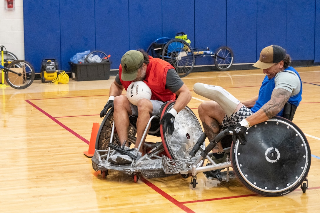 RSMs collide during wheelchair rugby practice.