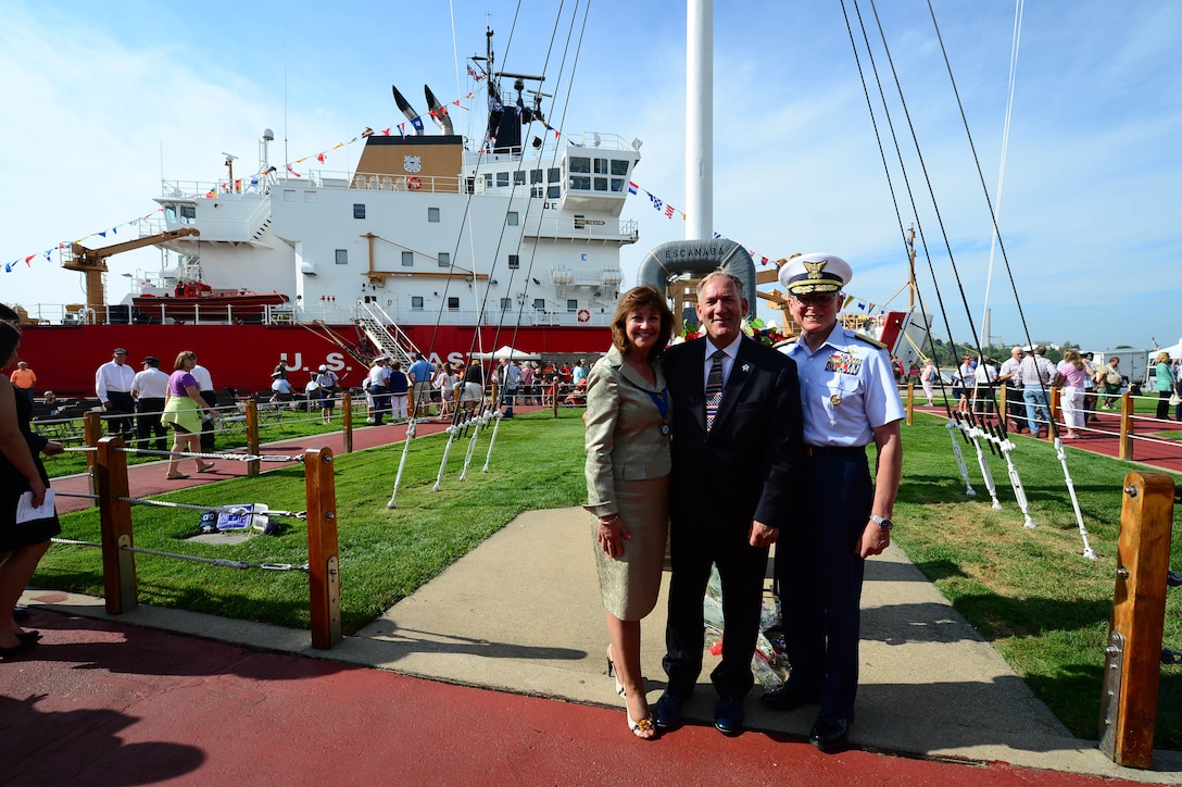 Cmdr. Mike Smith, center, at the 2013 Coast Guard Festival in Grand Haven, MI., Thurs. Aug. 2, 2013.