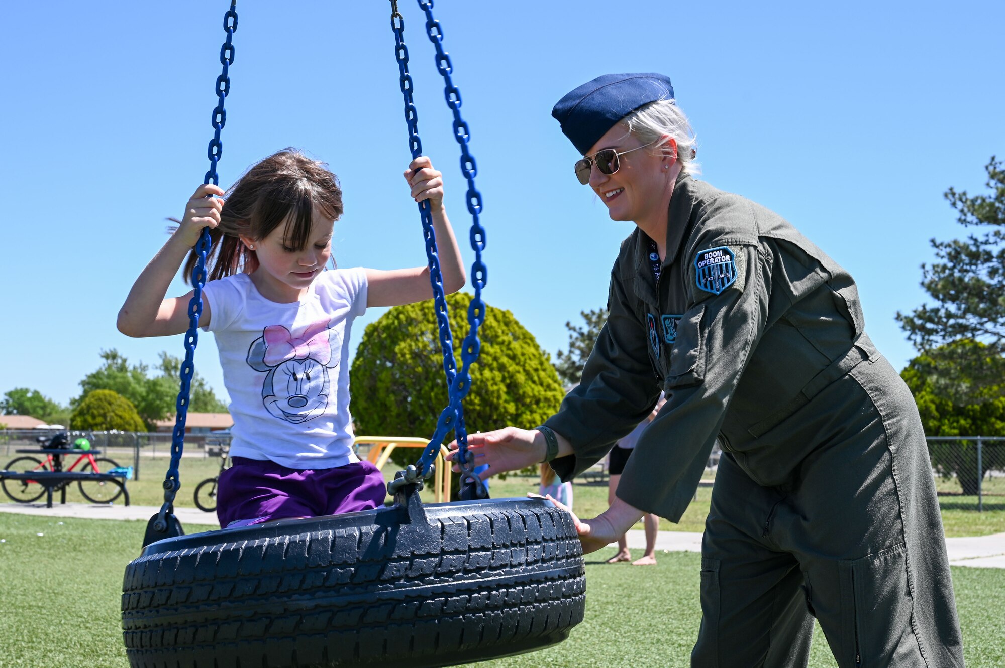 U.S. Air Force Staff Sgt. Lacy Pickett, 54th Air Refueling Squadron boom operator instructor, pushes her daughter, Carson, in a tire swing at Altus Air Force Base, Oklahoma, May 5, 2023. Of the 472,410 active duty parents, 85.8% are male and 14.2% are female. (U.S. Air Force photo by Senior Airman Kayla Christenson)