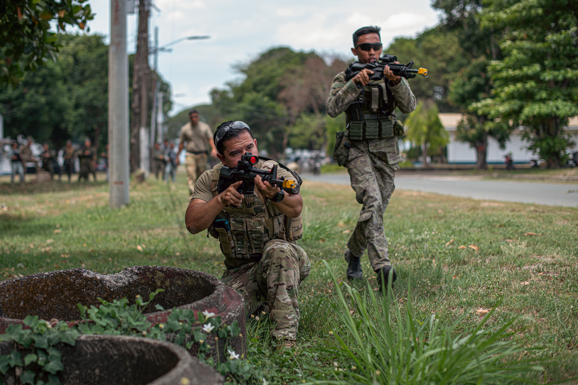 Tech. Sgt. Daniel Corral, left, 36th Security Forces Squadron defender, and a Philippine air force member practice covered movement procedures during subject matter expert exchanges as part of exercise Cope Thunder at Basa Air Base, Philippines, May 3, 2023. By strengthening alliances and partnerships with key Allies like the Philippines, the U.S. creates a networked security architecture capable of deterring aggression, maintaining stability and ensuring free access to common domains in accordance with international law. (U.S. Air Force photo by Senior Airman Sebastian Romawac)