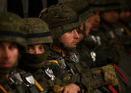 Spanish paratroopers with the Grupo De Artilleria sit on a C-17 Globemaster III assigned to Joint Base Lewis-McChord, Washington, during DEFENDER 23 at Base Aerea De Zaragoza, Spain, May 10, 2023. DEFENDER 23 is a U.S. Army Europe and Africa-led exercise, supported by U.S. Air Forces in Europe – Air Forces Africa, focused on the strategic deployment of continental United States-based forces and interoperability with Allies and partners. Taking place from April 22 to June 23, DEFENDER 23 demonstrates the U.S. Air Force’s ability to aggregate U.S.-based combat power quickly in Europe; increase lethality of the NATO Alliance through the U.S. Air Force’s Agile Combat Employment; build unit readiness in a complex joint, multi-national environment; and leverage host nation capabilities to increase USAFE-AFAFRICA’s operational reach. DEFENDER 23 includes more than 7,800 U.S. and 15,000 multi-national service members from various Allied and partner nations. (U.S Air Force photo by Senior Airman Callie Norton)