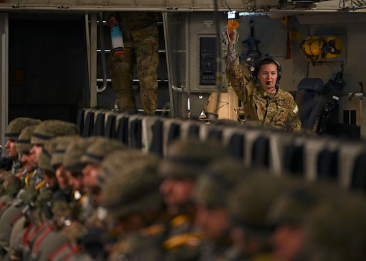 U.S Air Force Senior Airman Abby Beachnau, loadmaster with the 7th Expeditionary Airlift Squadron, gives a pre-flight safety brief to Spanish paratroopers with the Grupo De Artilleria on a C-17 Globemaster III assigned to Joint Base Lewis-McChord, Washington, during DEFENDER 23 at Base Aerea De Zaragoza, Spain, May 10, 2023. DEFENDER 23 is a U.S. Army Europe and Africa-led exercise, supported by U.S. Air Forces in Europe – Air Forces Africa, focused on the strategic deployment of continental United States-based forces and interoperability with Allies and partners. Taking place from April 22 to June 23, DEFENDER 23 demonstrates the U.S. Air Force’s ability to aggregate U.S.-based combat power quickly in Europe; increase lethality of the NATO Alliance through the U.S. Air Force’s Agile Combat Employment; build unit readiness in a complex joint, multi-national environment; and leverage host nation capabilities to increase USAFE-AFAFRICA’s operational reach. DEFENDER 23 includes more than 7,800 U.S. and 15,000 multi-national service members from various Allied and partner nations. (U.S Air Force photo by Senior Airman Callie Norton)