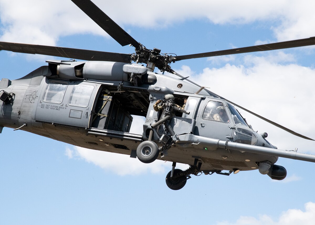 A HH-60 Pave Hawk helicopter flown by the 106th Rescue Wing provides air support during a training exercise at Warren Grove Bombing Range, Ocean County, New Jersey, May 6, 2023. Airmen of the 105th Base Defense Squadron and the 106th Rescue Wing and Soldiers from the U.S. Army National Guard’s 20th Special Forces Group honed expeditionary skills during the exercise.