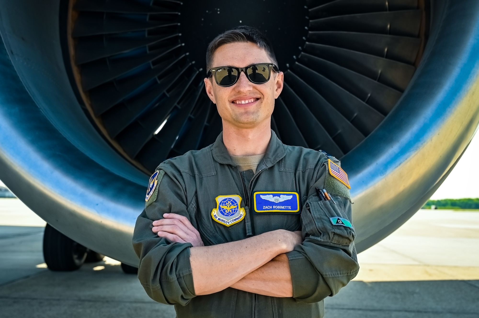 U.S. Air Force Capt. Zach Robinette, 305th Air Mobility Wing pilot, poses for a flight line photo on 11 May, 2023 at Joint Base McGuire-Dix-Lakehurst, N.J. Robinette is a part of the last crew to fly a local KC-10 Extender sortie from the 305th AMW. The 305th AMW extends America's global reach by generating, mobilizing and deploying KC-10 Extenders and C-17 Globemaster III’s to conduct strategic airlift and air refueling missions worldwide. In November 2021, the Wing began transitioning to the new KC-46A Pegasus air refueling aircraft.