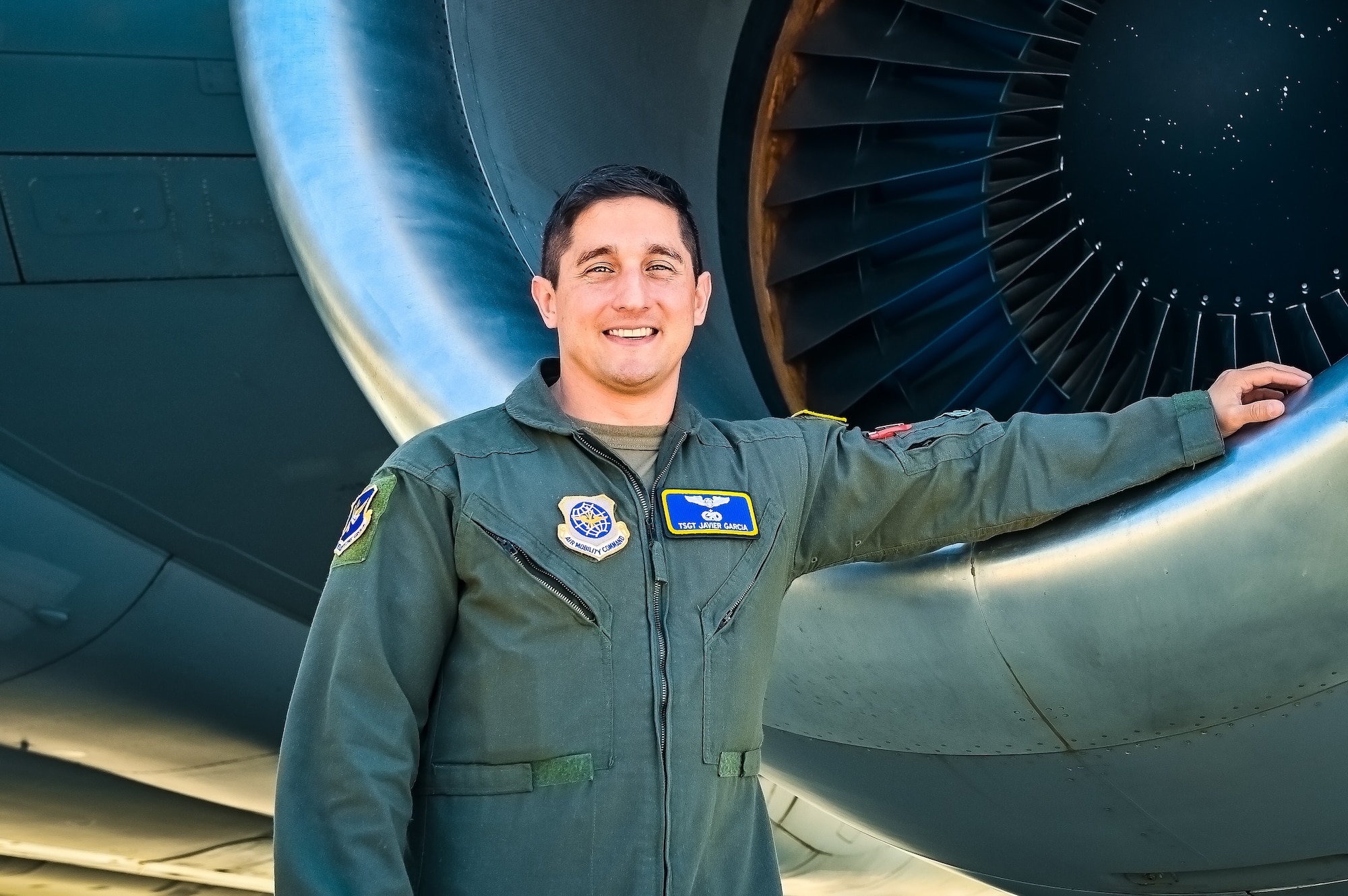 U.S. Air Force Tech. Sgt. Javier Garcia, 305th Air Mobility Wing boom operator, poses for a flight line photo on 11 May, 2023 at Joint Base McGuire-Dix-Lakehurst, N.J. Garcia is a part of the last crew to fly a local KC-10 Extender sortie from the 305th AMW. The 305th AMW extends America's global reach by generating, mobilizing and deploying KC-10 Extenders and C-17 Globemaster III’s to conduct strategic airlift and air refueling missions worldwide. In November 2021, the Wing began transitioning to the new KC-46A Pegasus air refueling aircraft.