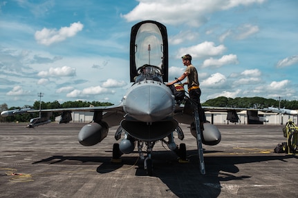 A 14th Fighter Squadron pilot and a crew chief assigned to the 14th Aircraft Maintenance Unit conduct preflight checks on a F-16 Fighting Falcon before a flight during Cope Thunder at Clark Air Base, Philippines, May 4, 2023. By strengthening alliances and partnerships with key Allies like the Philippines, the U.S. creates a networked security architecture capable of deterring aggression, maintaining stability and ensuring free access to common domains in accordance with international law. (U.S. Air Force photo by Senior Airman Sebastian Romawac)