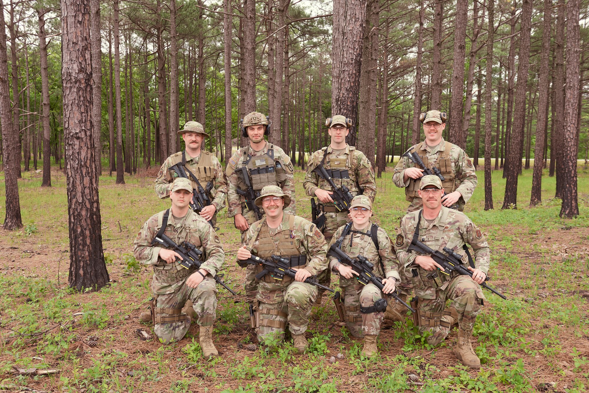 Photo of The Vermont National Guard marksman ship team getting coined by Command Chief Master Sgt. Adrianne Schulz, the 158th Fighter Wing command Chief, during the Winston P. Wilson competition at Camp Robinson, Arkansas, May 5, 2023.