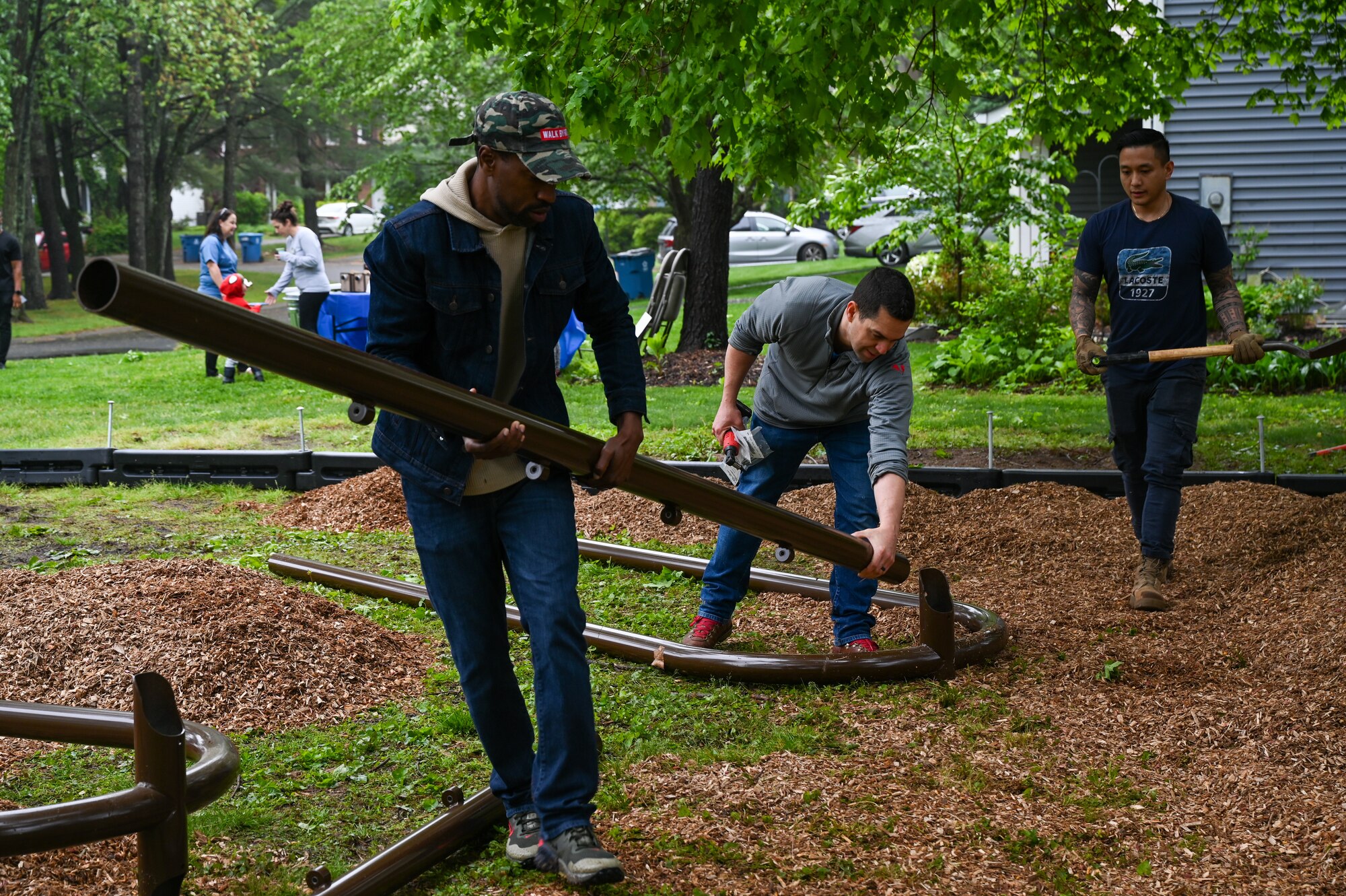 Members of the 113th Civil Engineer Squadron, District of Columbia Air National Guard, spread mulch and arrange segments of playground equipment as they participate in a volunteer project to complete the Master Sgt. Scott Walters Memorial Playground in Vienna, Virginia, April 29th, 2023. Walters, a well-loved member of the unit and community organizer, asked for the playground to be constructed as one of his final wishes. (U.S. Air Force photo by Tech. Sgt. Andrew Enriquez)