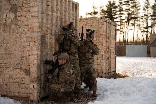 Defenders assigned to the 157th Security Forces Squadron enter a simulated hostile environment