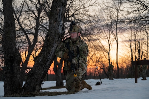 Senior Airman Nathan Willard, a defender with the 157th Security Forces Squadron, provides part of a 360-degree security around the exercise barrier