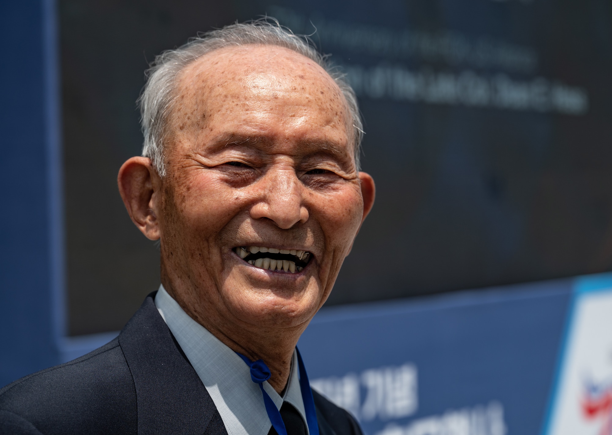 Mr. Kim, former Republic of Korea pilot, smiles during the Dean Hess Commemorative Ceremony at Jeju Aerospace Museum, Jeju, Republic of Korea, May 11, 2023