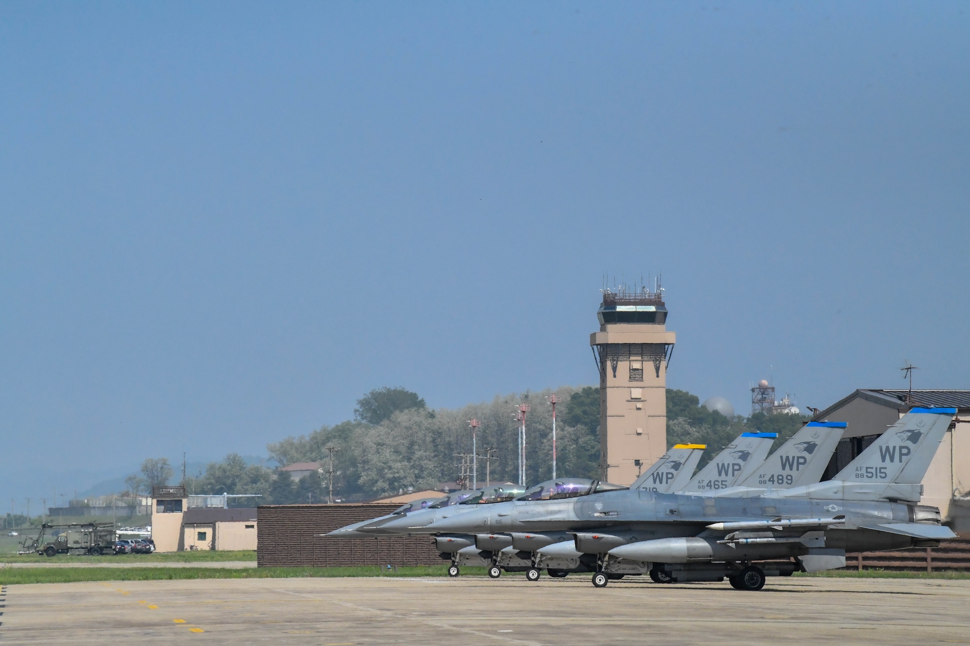 jets lined up with tower in background