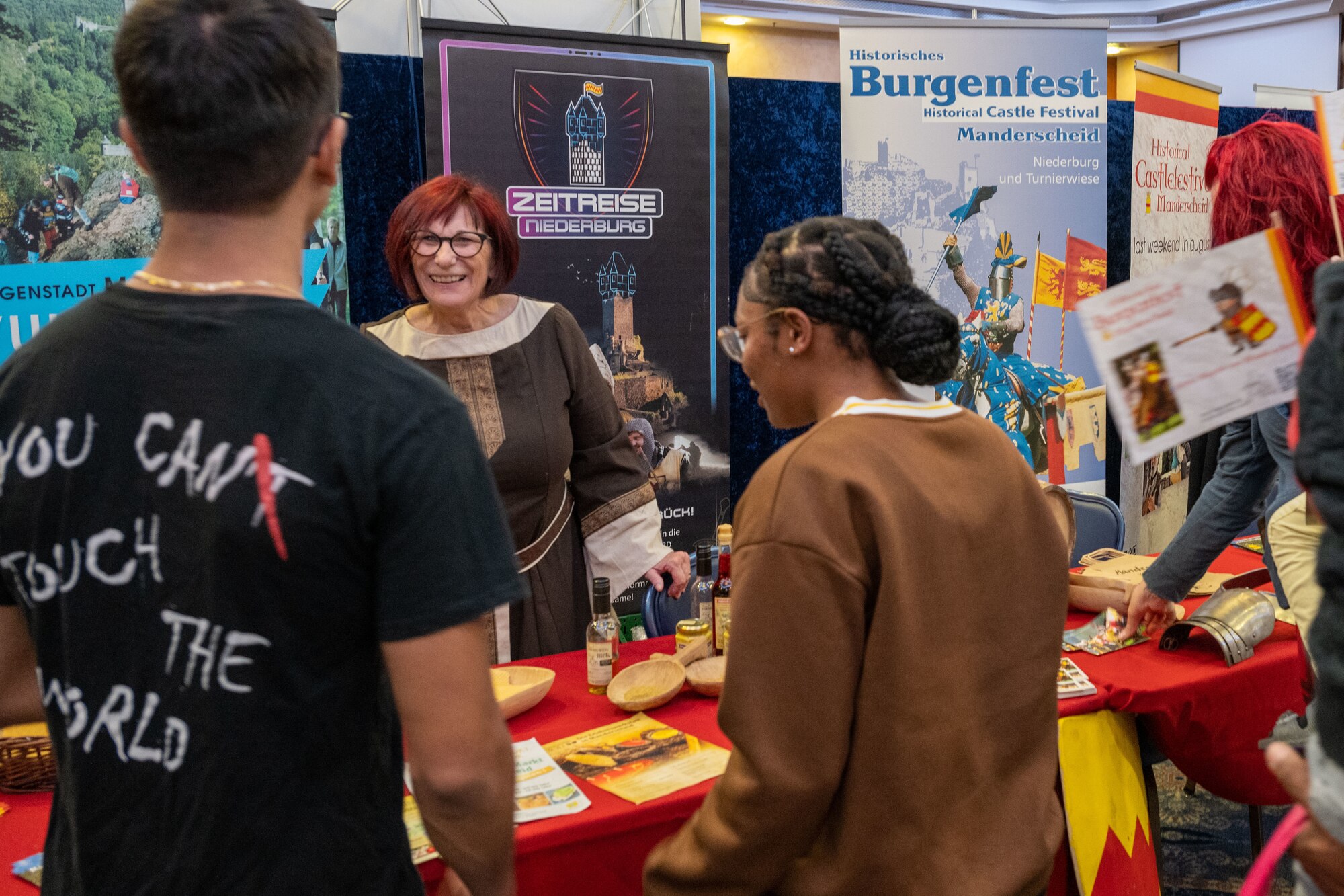 Members from Spangdahlem visit a German local vendor booth during Explore the Eifel May 12, 2023, at Spangdahlem Air Base, Germany. The 52nd Fighter Wing hosted its 18th Explore the Eifel community culture event at Club Eifel to promote partnership with the local community and celebrate major milestones for the installation. (U.S. Air Force photo by Senior Airman Jessica Sanchez-Chen)