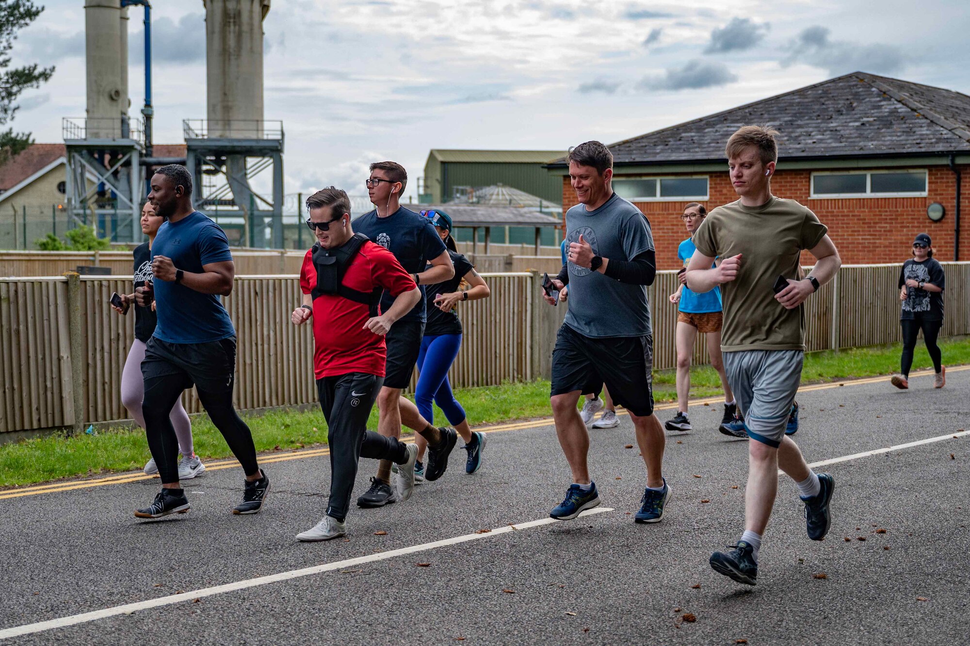 A group of Airmen run a 5k to celebrate the kick off of Asian American and Pacific Islander month at Royal Air Force Mildenhall, England, May 5, 2022. This year, events including a volleyball tournament, children’s story time, and trivia night are scheduled to highlight the monthly observance. (U.S. Air Force photo by Senior Airman Viviam Chiu)