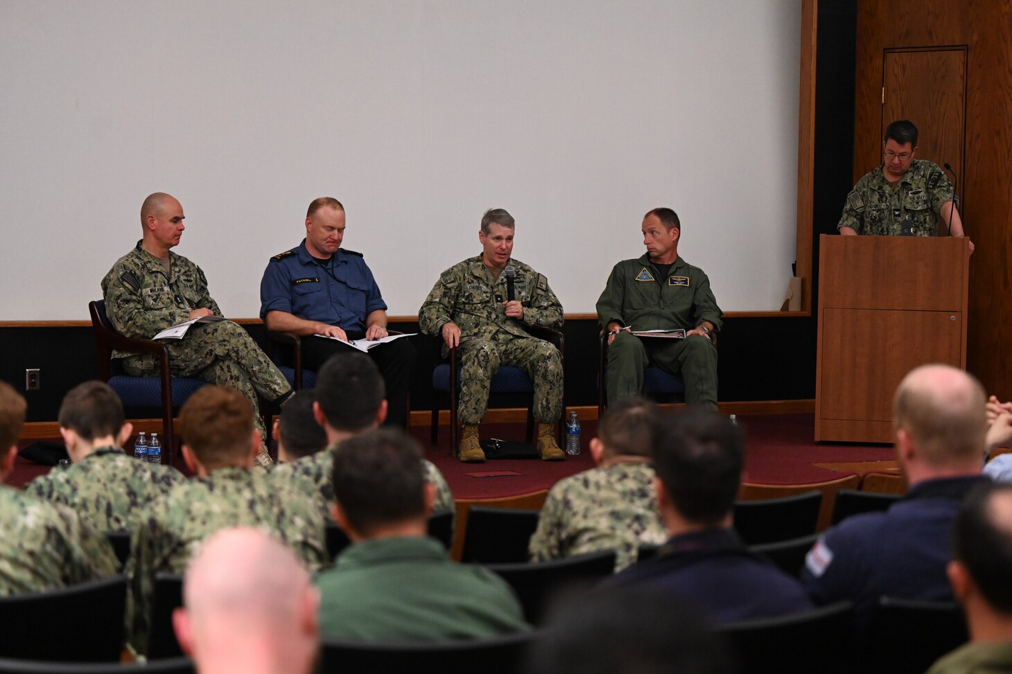 Rear Adm. Brian Davies, Commander, Submarine Group Two, speaks to junior officers about undersea warfare operations during the Junior Officer Undersea Warfare Symposium and Training (JOUST) onboard Naval Support Activity  (NSA) Hampton Roads.